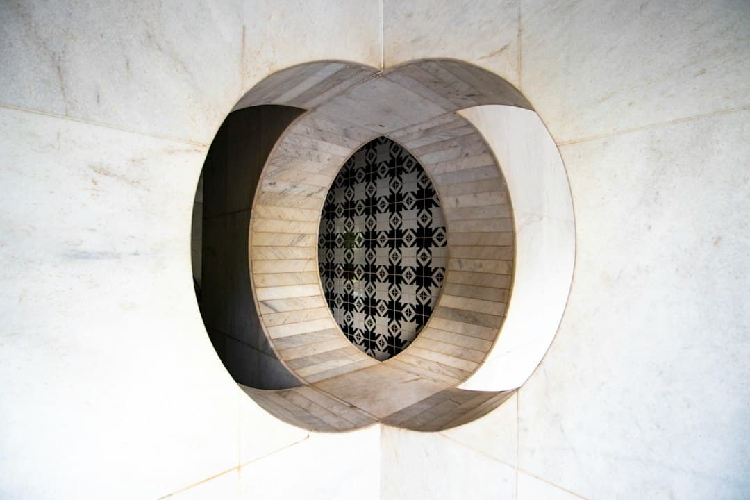 brown round concrete tunnel with black round hole — Photo by Yuri Vasconcelos on Unsplash