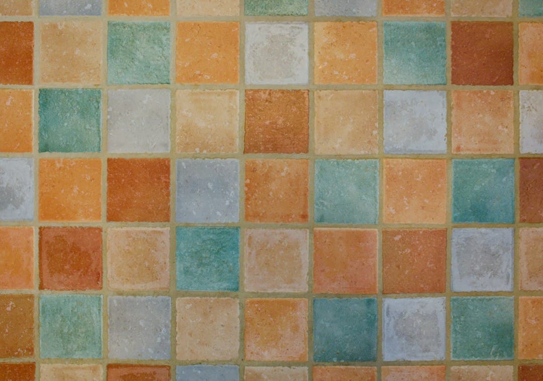 Colorful square tiles arranged in a grid pattern — Photo by Colin Watts on Unsplash