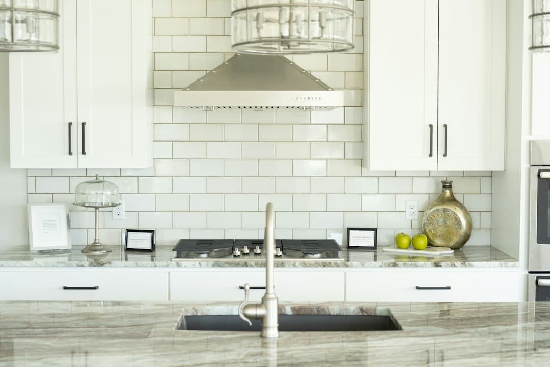 white and silver kitchen sink — Photo by carolyn christine on Unsplash