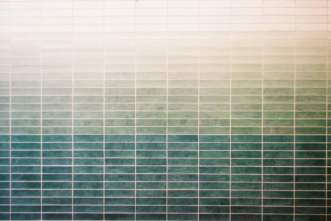 Grid with gradient of white to teal — Photo by Ana Ova on Unsplash