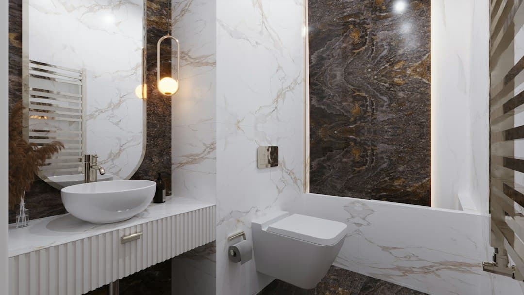 a bathroom with a tub sink and toilet — Photo by Medea Dzagnidze on Unsplash