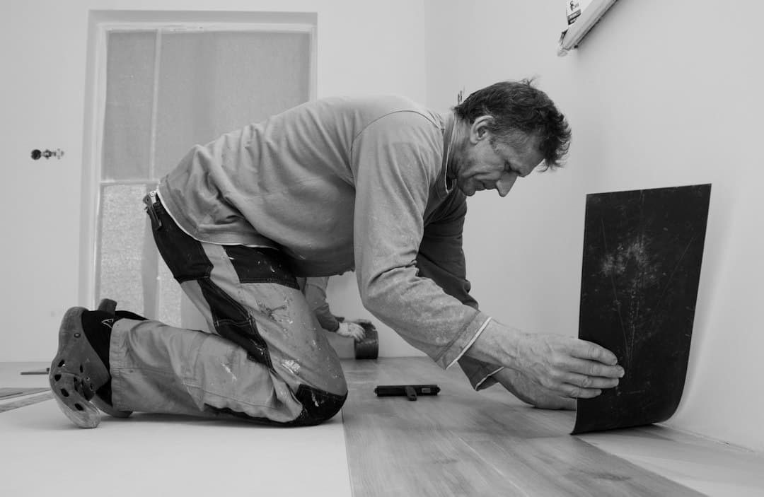 A man laying on the floor in a room — Photo by Ernys on Unsplash